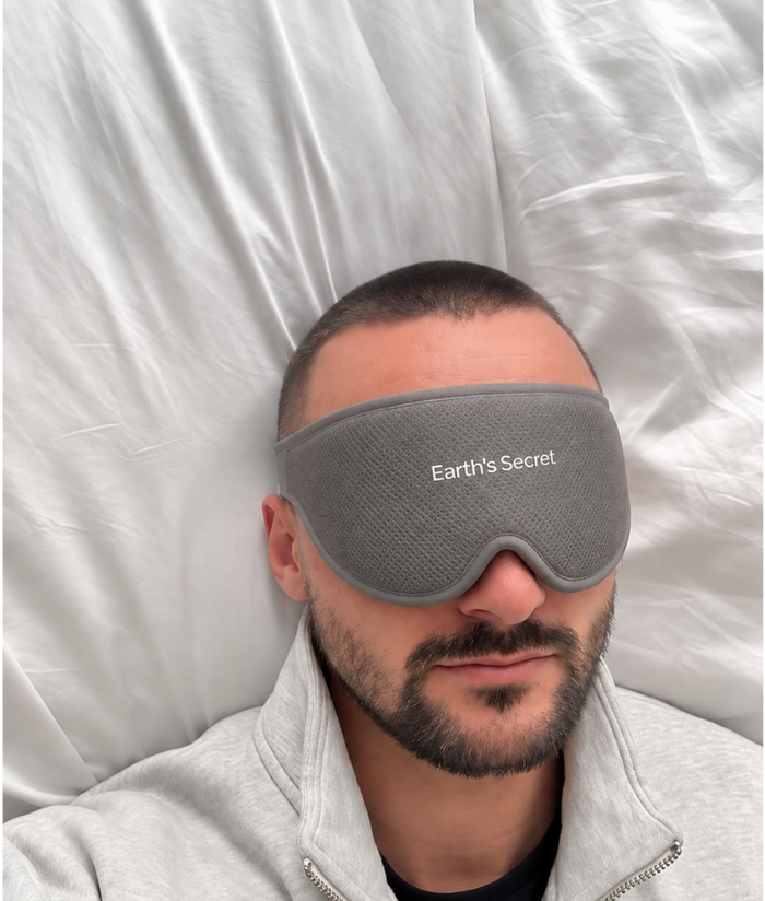 Man asleep on his back wearing the Dream mask