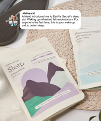 Sleep supplement package with packaging and a product on a textured surface.
